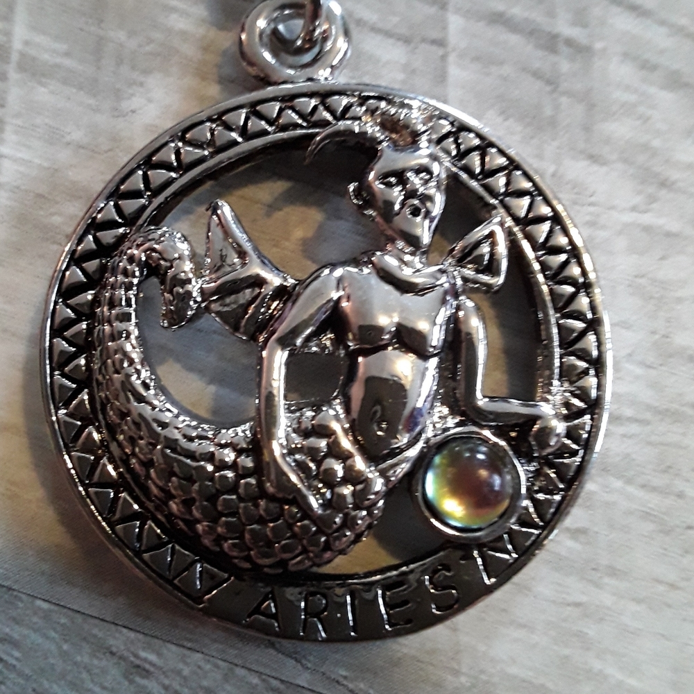 Silver tone unusual Aries keychain